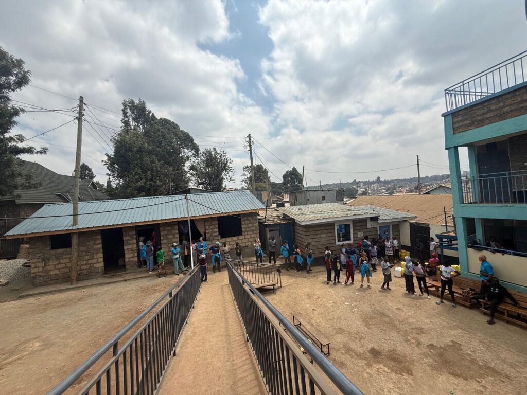 Children gathered in the courtyard between the Centre buildings