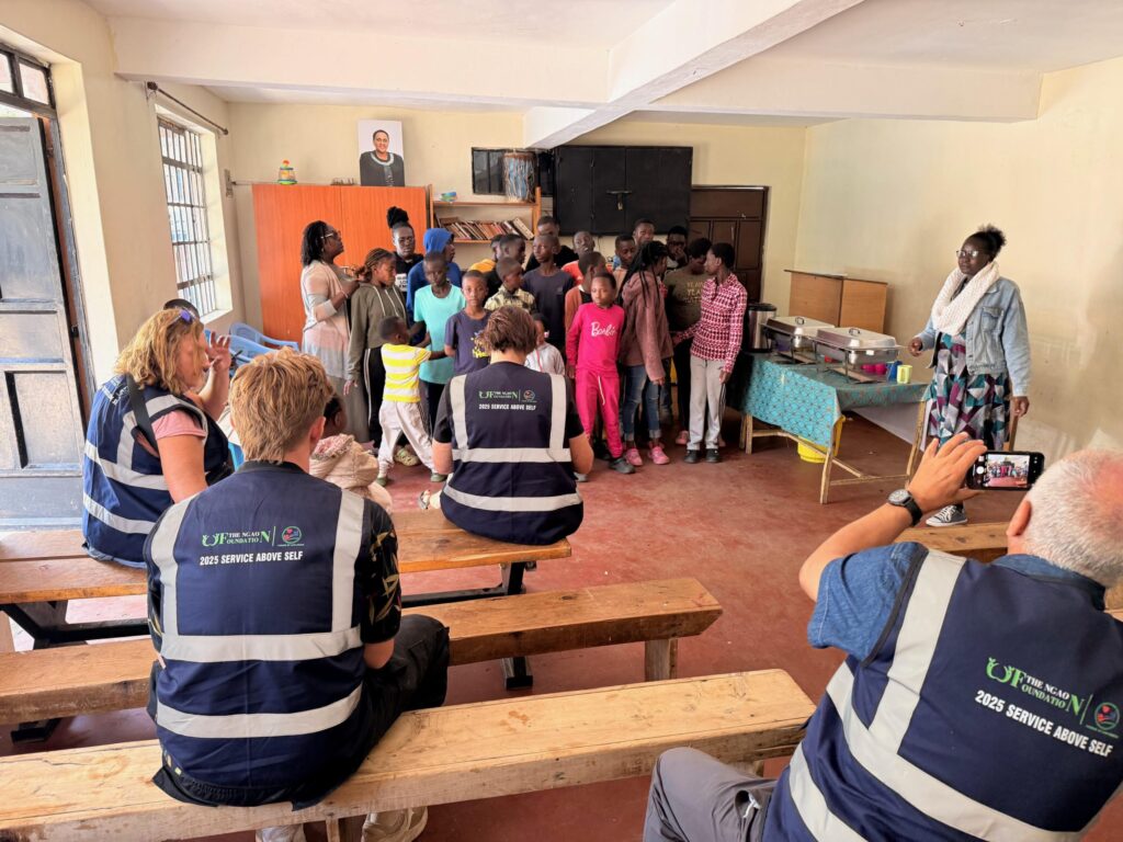 Service trip volunteers with children in a classroom in Kibera